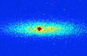 Fluorescence image of a single trapped Sr+ ion immersed in a cloud of 100,000 trapped Rb atoms. The ion is trapped by radio-frequency fields. The atoms are trapped by a focused laser-beam. Both species are cooled to a temperature of a millionth of a degree Kelvin above absolute zero temperature